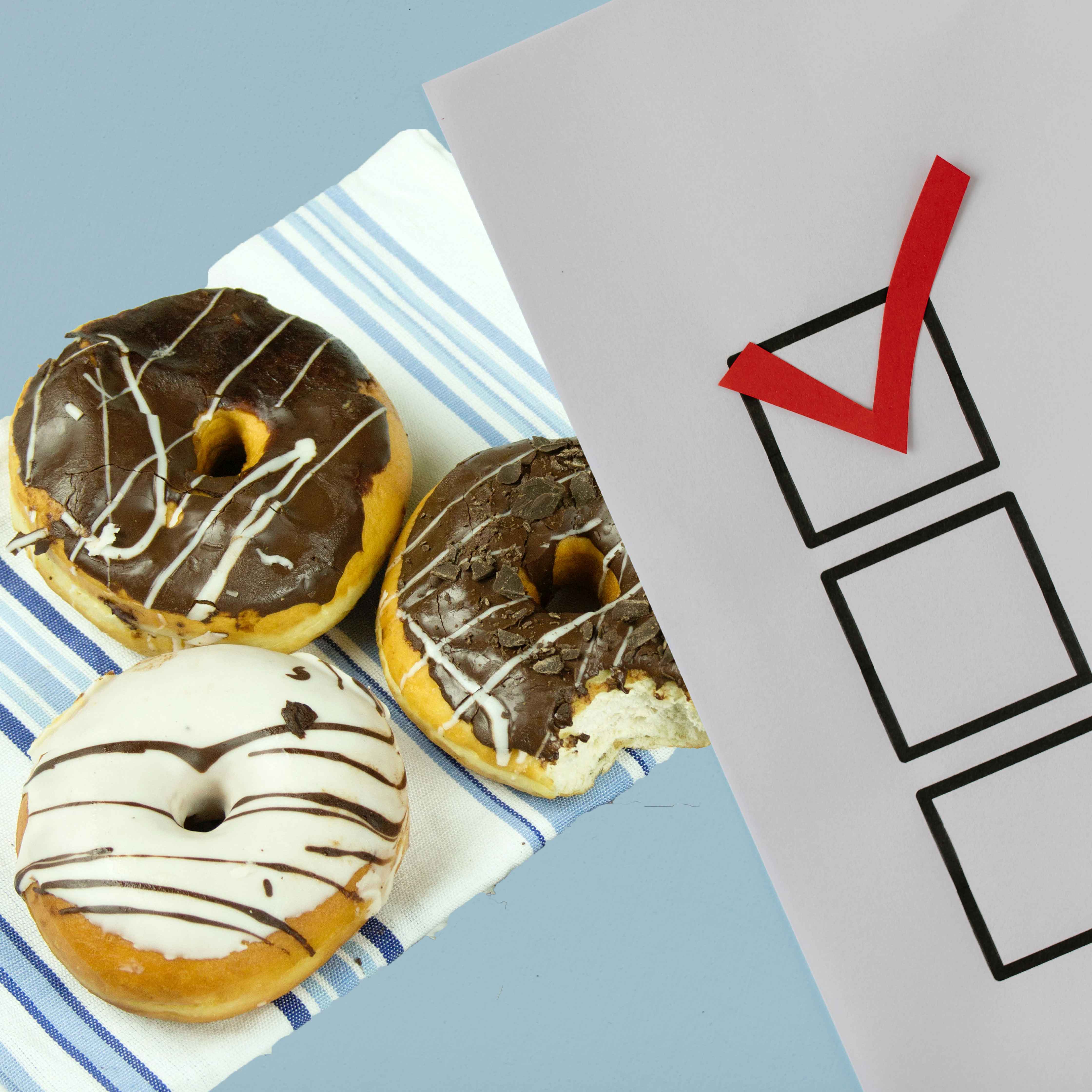 Voting card with donuts in the background