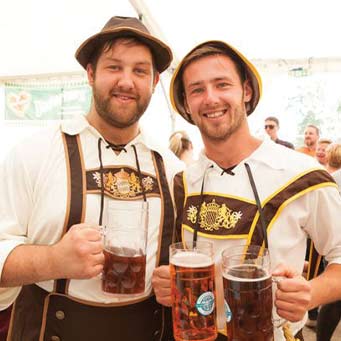 Spotlight, image of two men in traditional German attire