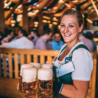 Activities, image of woman holding several beer mugs