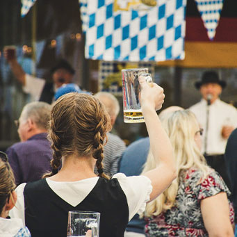 Schedule, and image of woman raising a glass