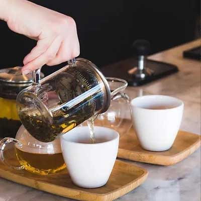 tea pouring into tea cup